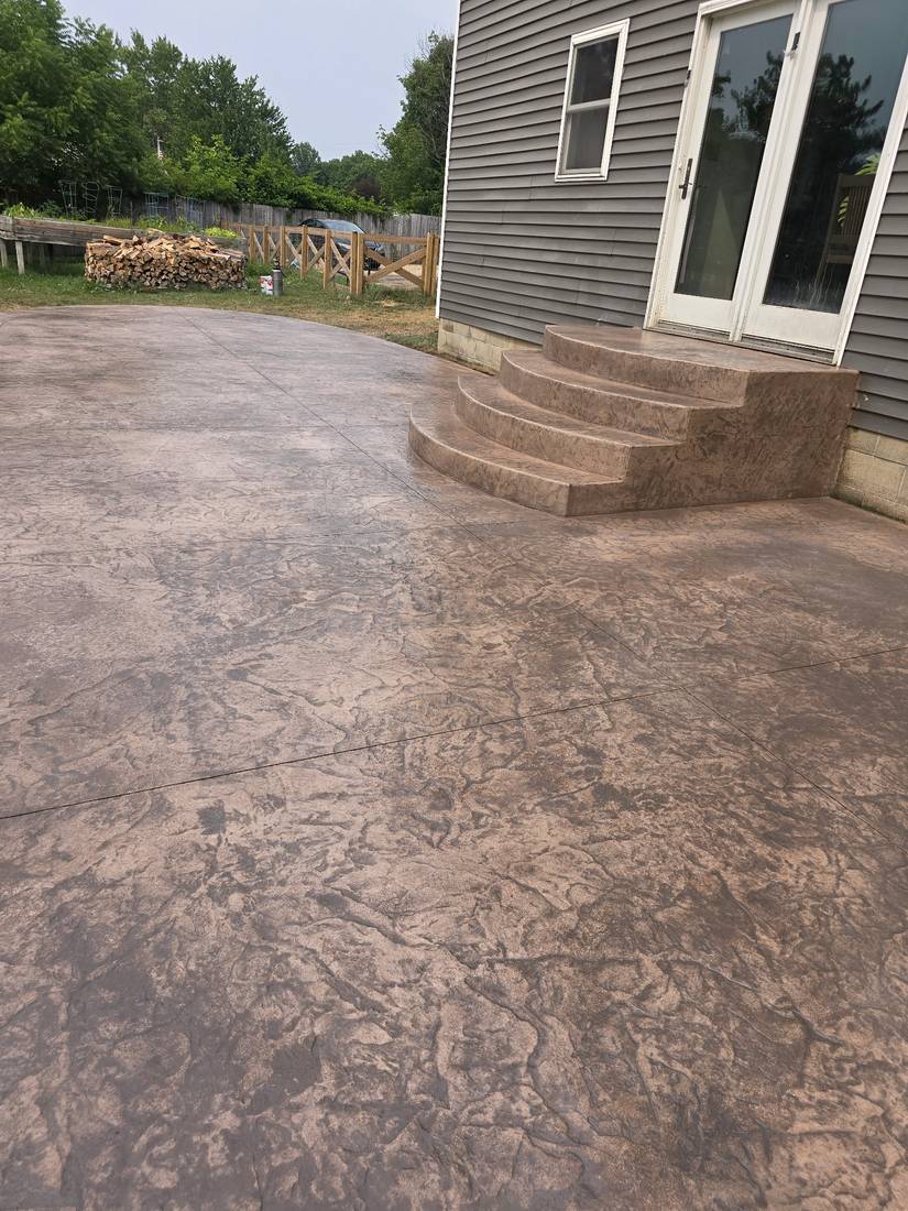 Curved stamped steps to the patio