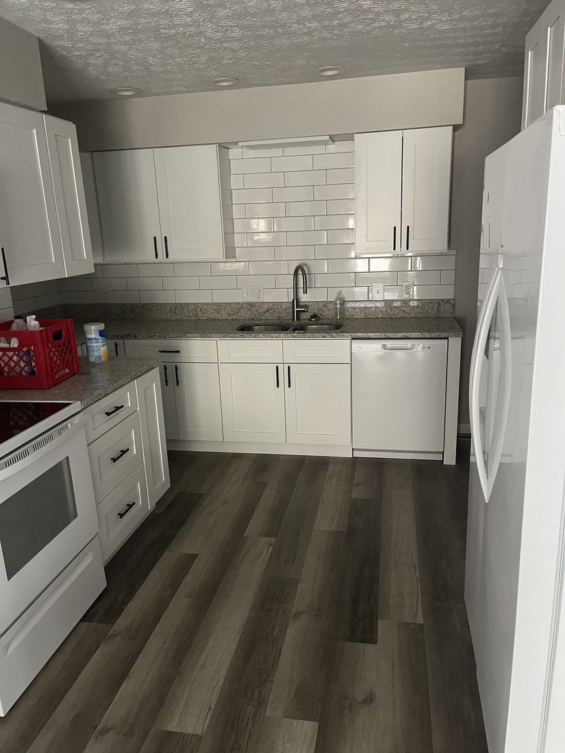 Shaker cabinets, granite and subway tile